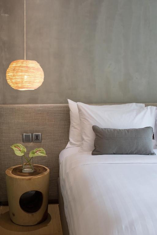 Postel nebo postele na pokoji v ubytování Ad Lib Hotel Bangkok