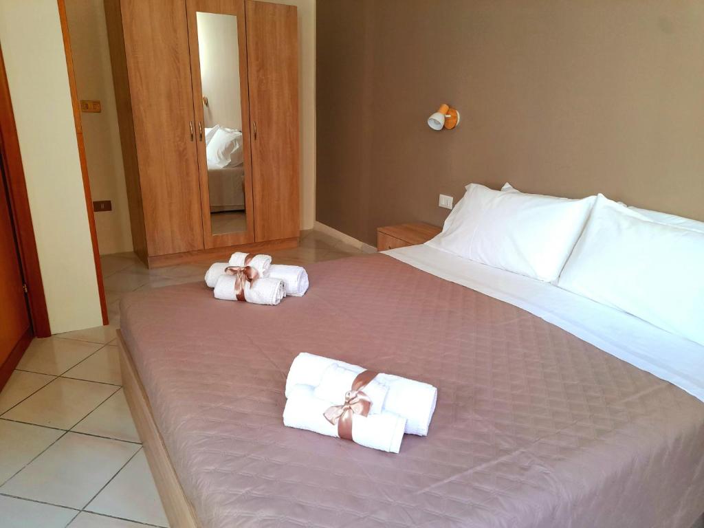 A bed or beds in a room at La Perla di Palermo