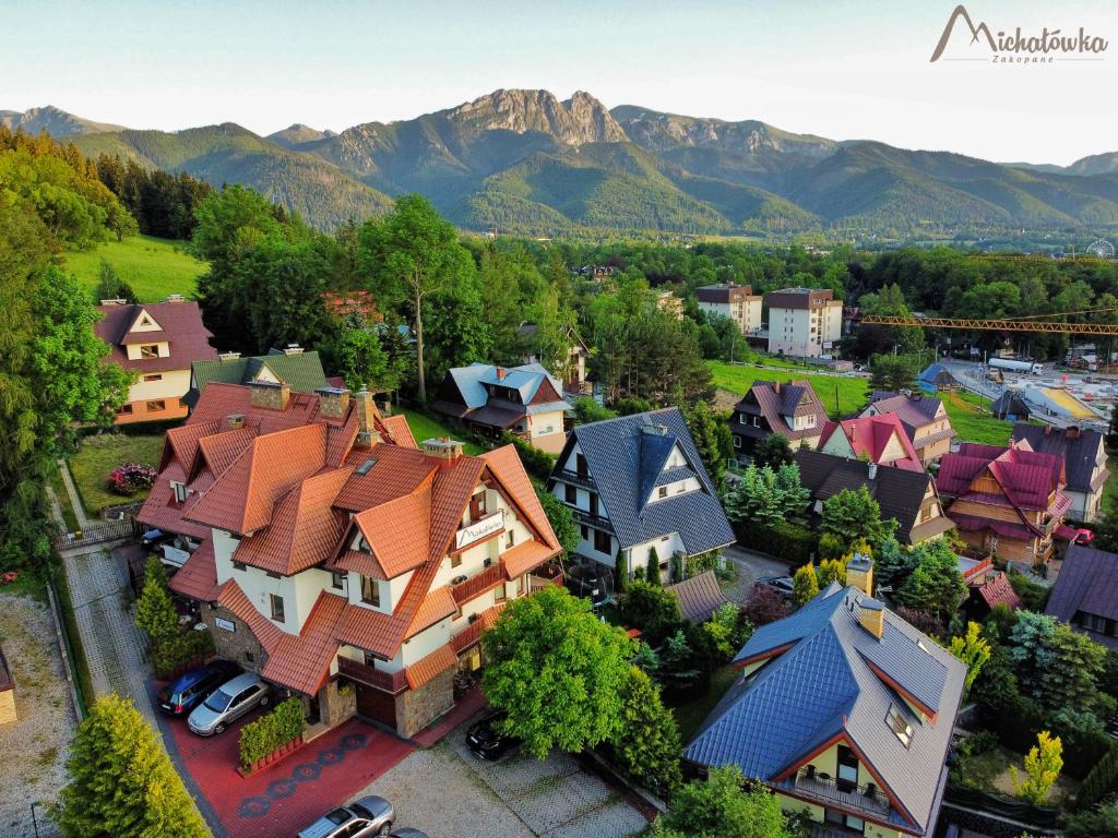 an aerial view of a town with houses and mountains at Willa Michałówka in Zakopane