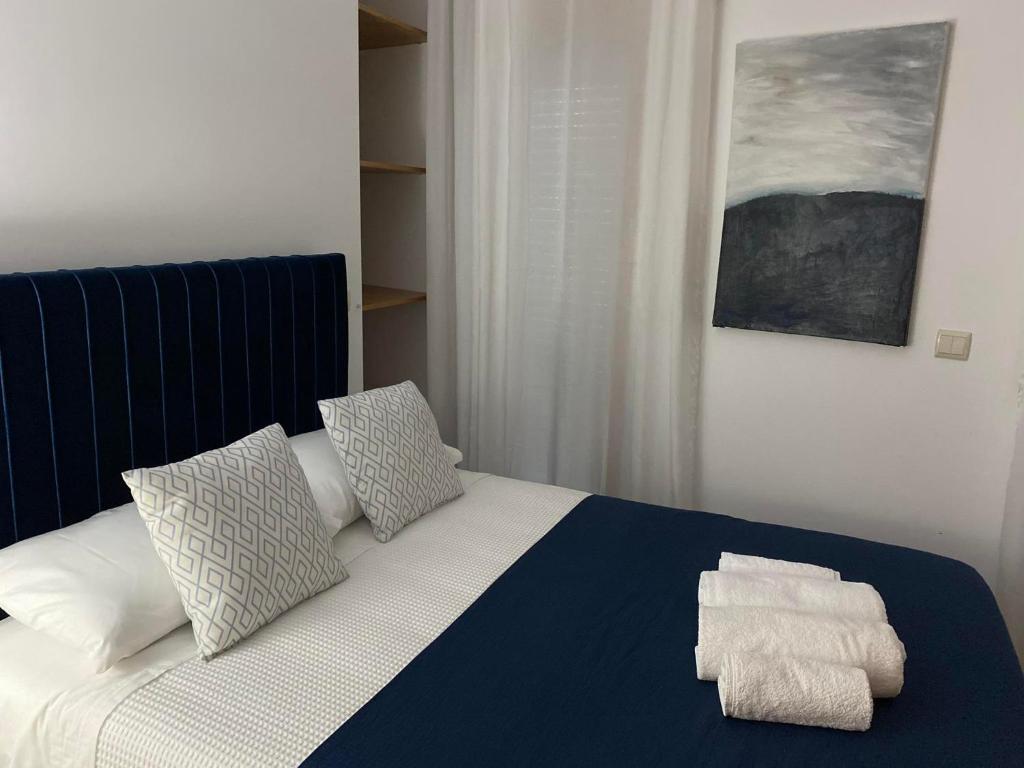 Ένα ή περισσότερα κρεβάτια σε δωμάτιο στο CASA MONTEVIDEU