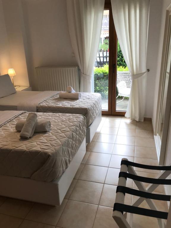 Postel nebo postele na pokoji v ubytování Amaryllis House
