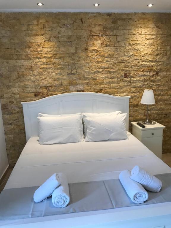 Postel nebo postele na pokoji v ubytování Amaryllis House