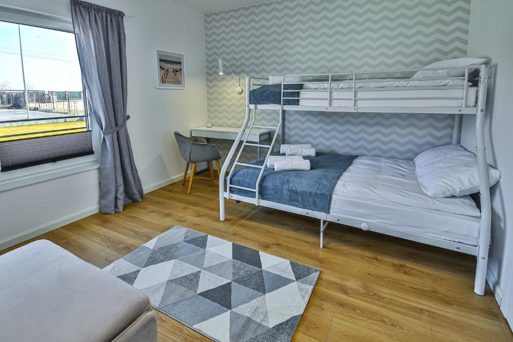 Postel nebo postele na pokoji v ubytování Klif Resort Apartamenty