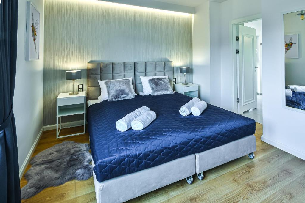 Postel nebo postele na pokoji v ubytování Klif Resort Apartamenty