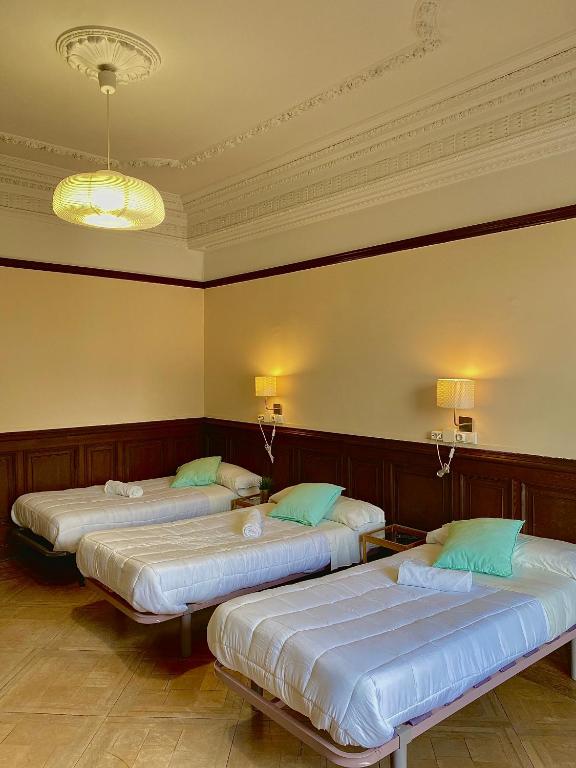 Postel nebo postele na pokoji v ubytování Zentric Hostel