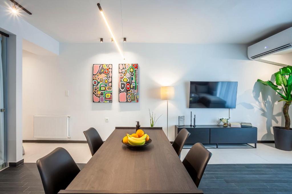 Televízia a/alebo spoločenská miestnosť v ubytovaní Habitat 29 A