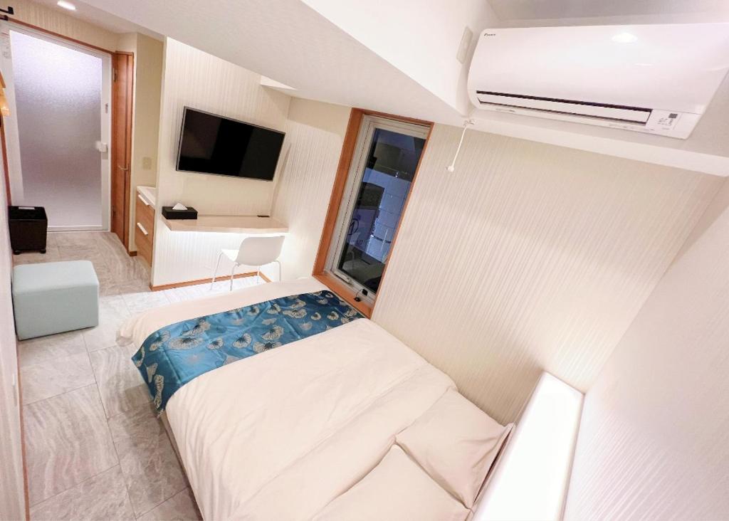 Postel nebo postele na pokoji v ubytování Hotel mond omiya
