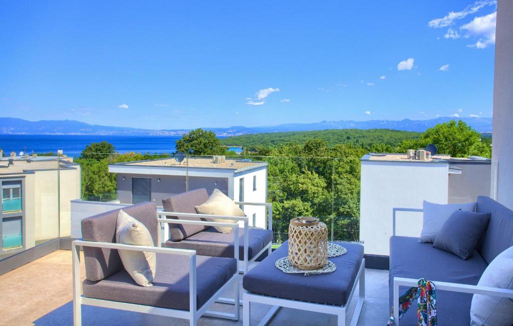 a balcony with chairs and a view of the ocean at Apartments Sol in Njivice
