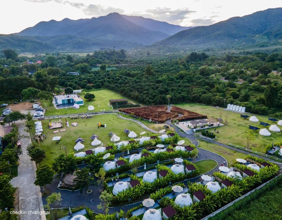 an aerial view of a resort with mountains in the background at ไร่บำรุงผล Raibumrungphol in Mae Wang