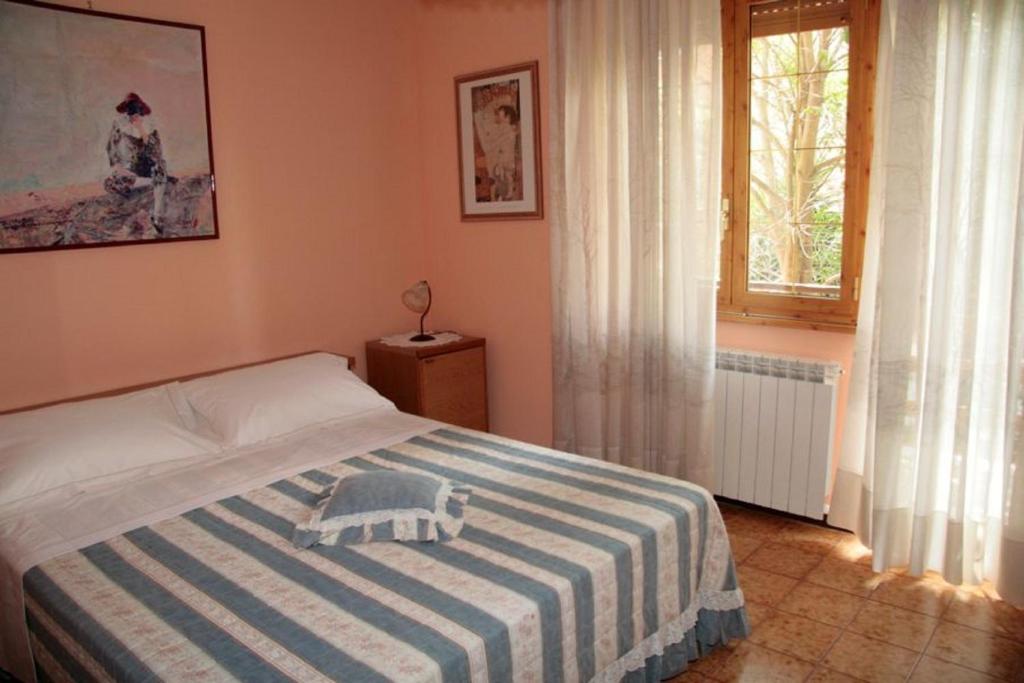 Łóżko lub łóżka w pokoju w obiekcie B&B Domus Gratiae