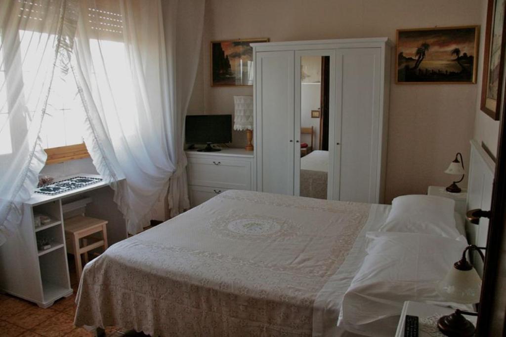 Łóżko lub łóżka w pokoju w obiekcie B&B Domus Gratiae