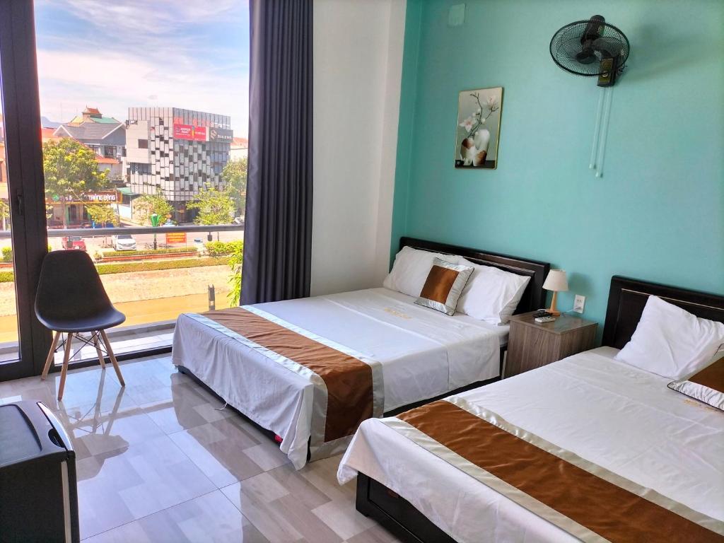 Giường trong phòng chung tại HOA MAI Plus Hostel