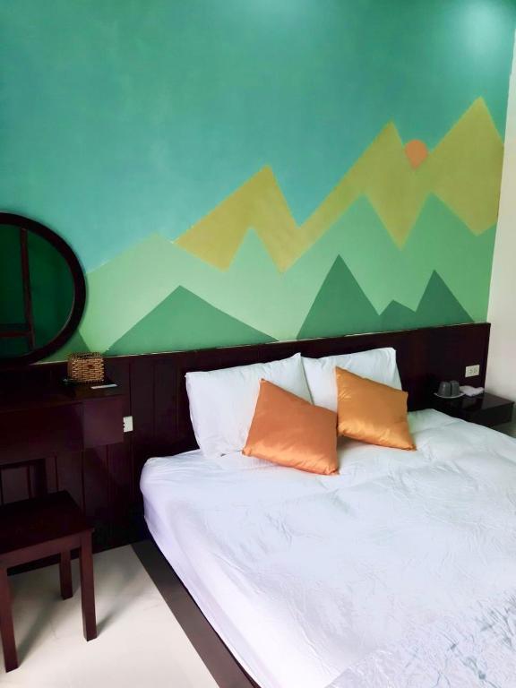 Postel nebo postele na pokoji v ubytování Lex Homestay Hotel