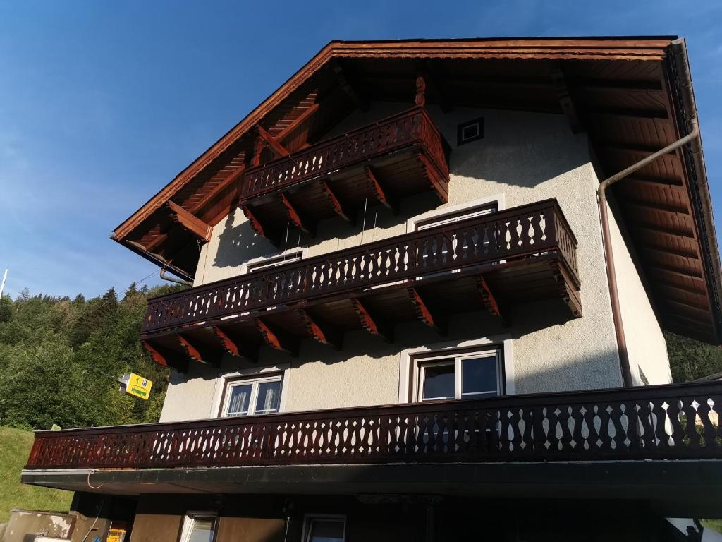 a building with a balcony on the side of it at Bike hostel Schladming in Schladming