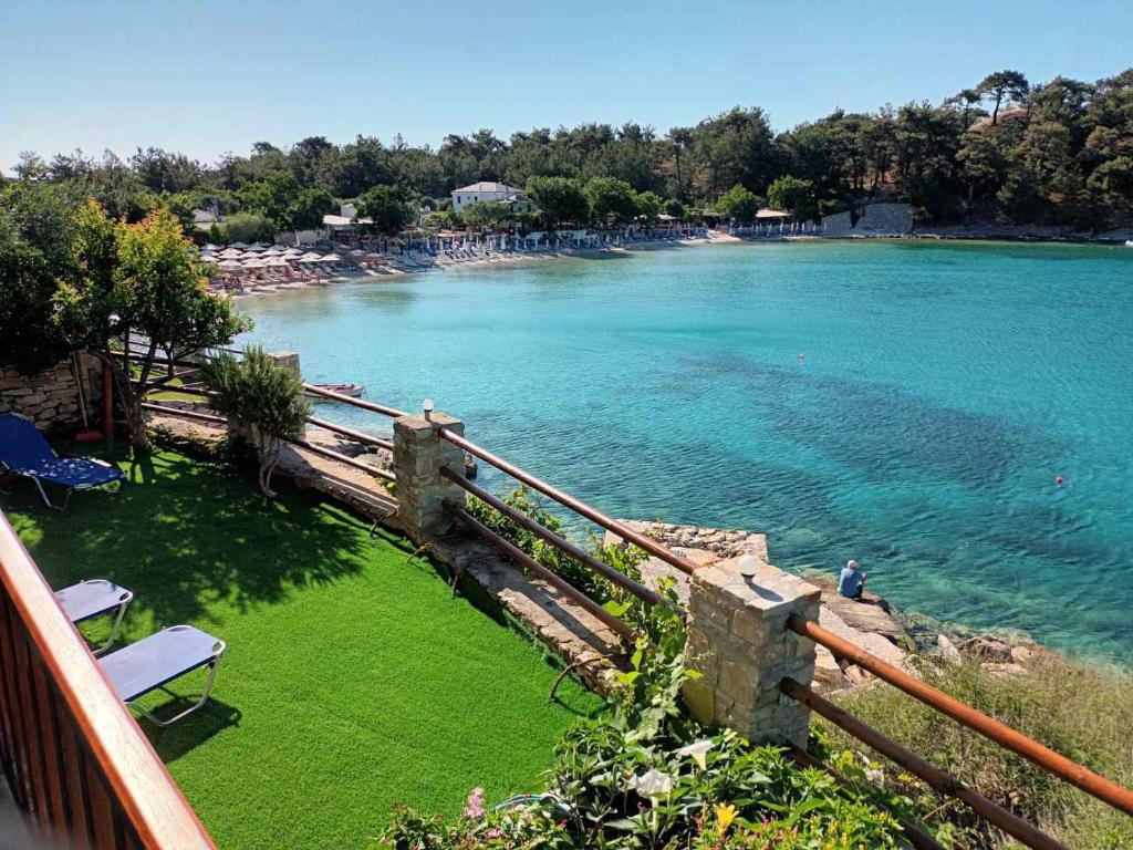 a view of a body of water from a balcony at Anthi Villa in Alyki