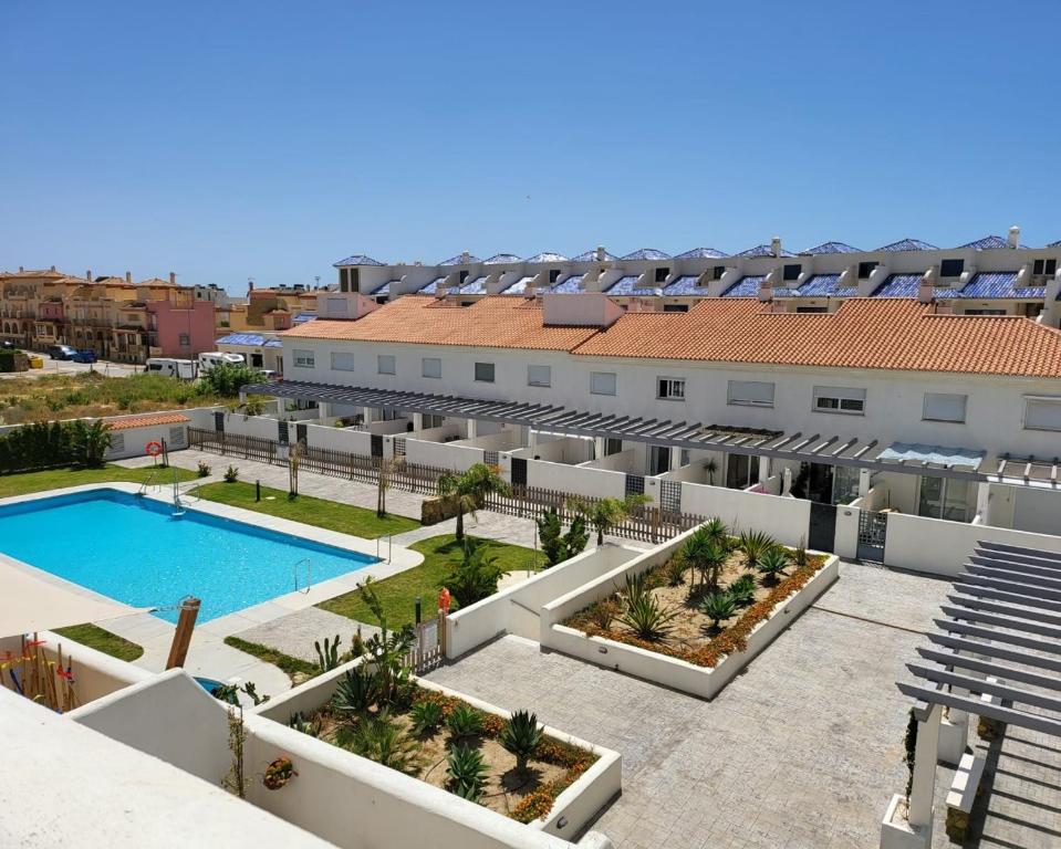 an aerial view of a building with a swimming pool at Tarifa Sol y Sal in Tarifa