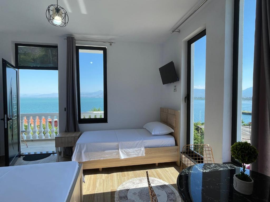 Postel nebo postele na pokoji v ubytování four generation hotel