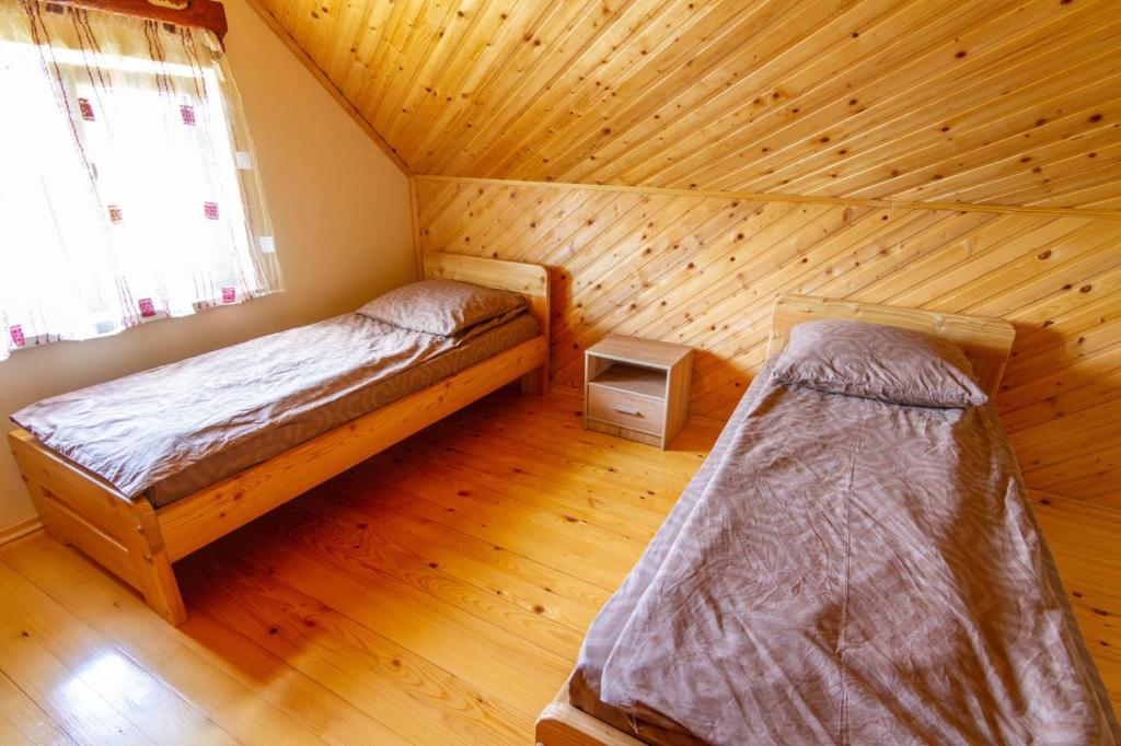 Postel nebo postele na pokoji v ubytování Садиба під Лісом