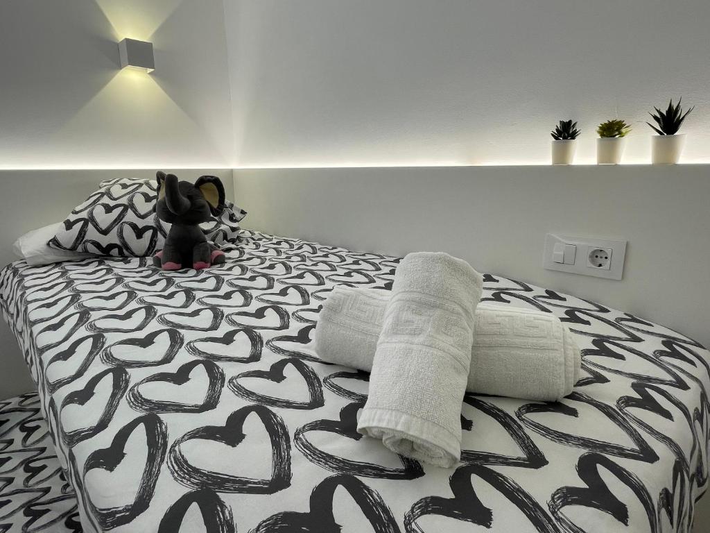 Posteľ alebo postele v izbe v ubytovaní OverTheSea - PUEBLECITO Apartment