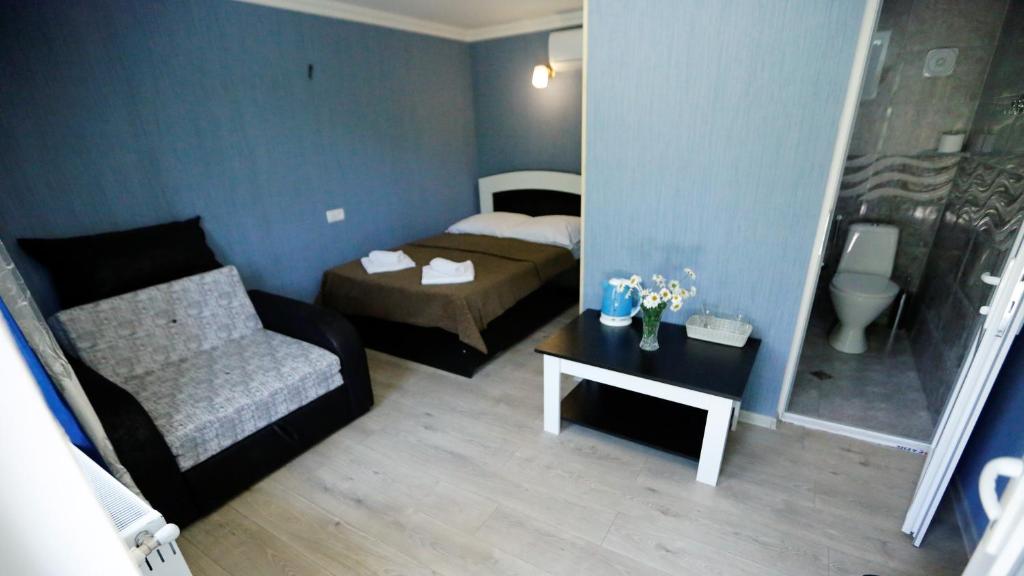 Postel nebo postele na pokoji v ubytování Lilia guesthouse
