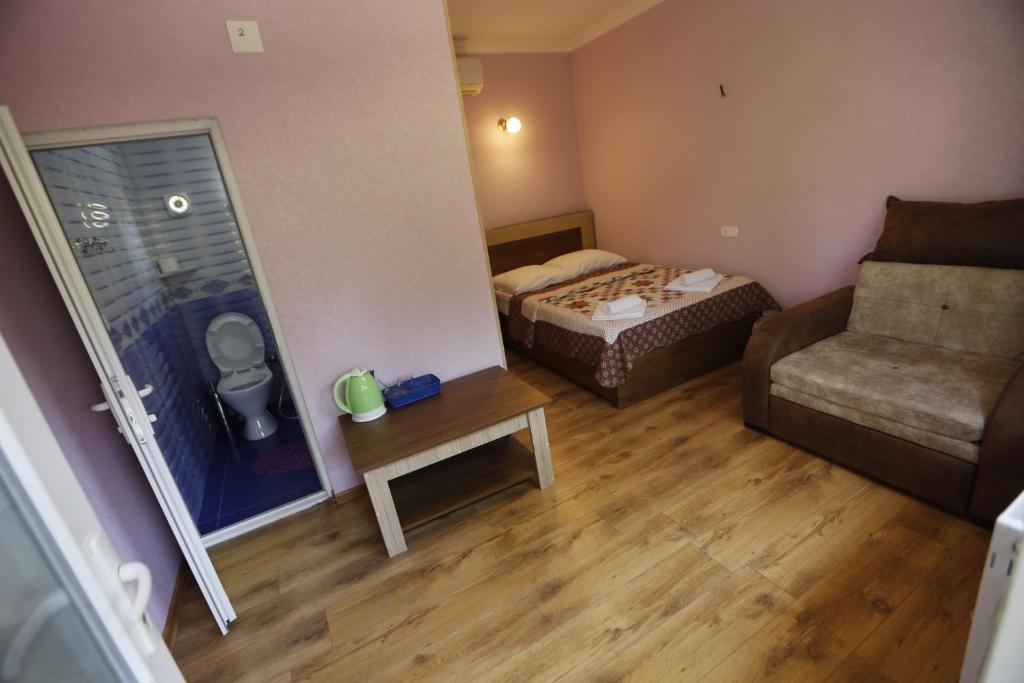 Postel nebo postele na pokoji v ubytování Lilia guesthouse