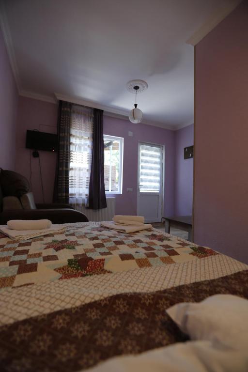 Postel nebo postele na pokoji v ubytování Lilia guesthouse