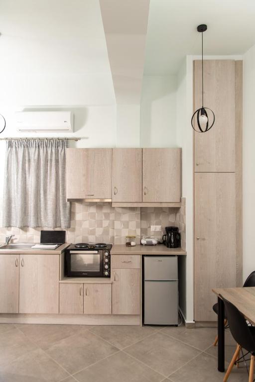Kuchyň nebo kuchyňský kout v ubytování Loggos Apartments