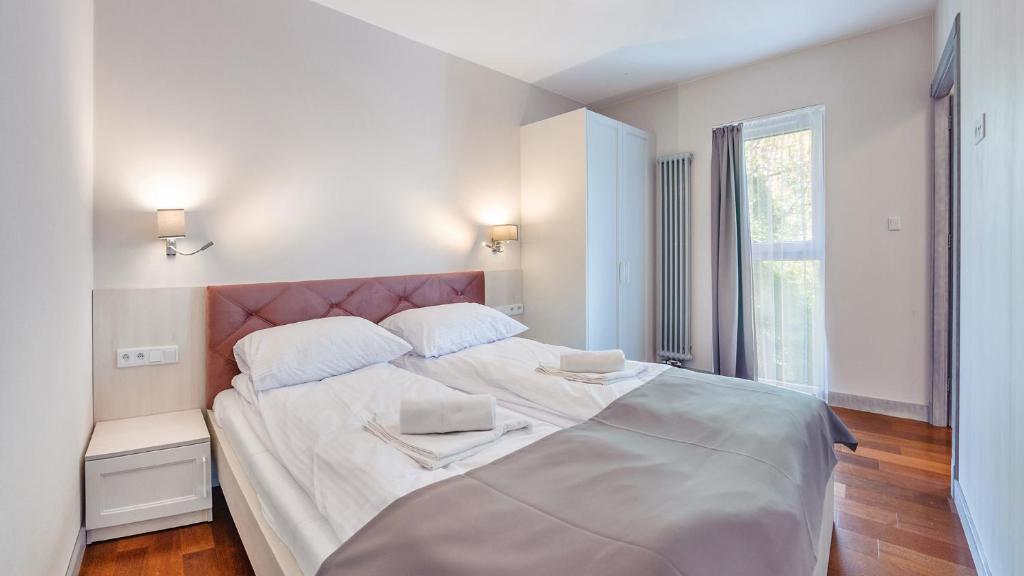 Posteľ alebo postele v izbe v ubytovaní Apartamenty Sopockie Błonie