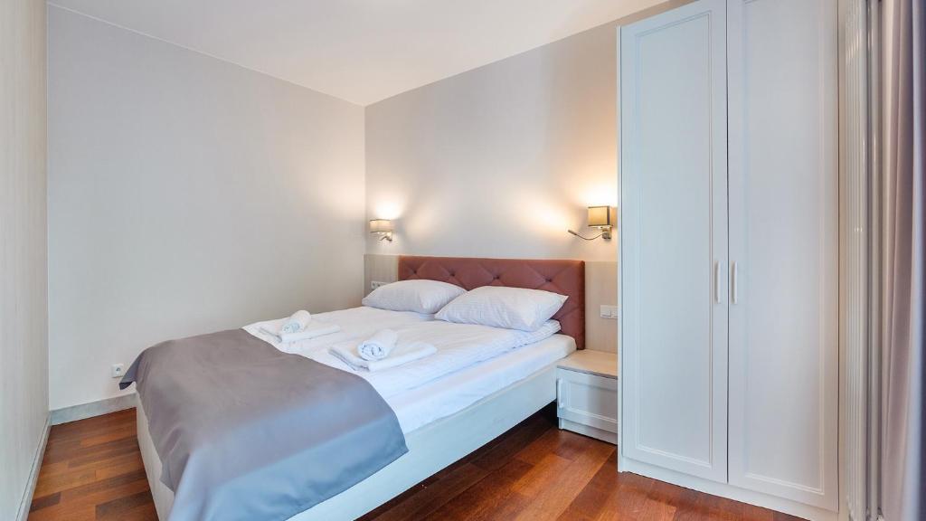 Posteľ alebo postele v izbe v ubytovaní Apartamenty Sopockie Błonie
