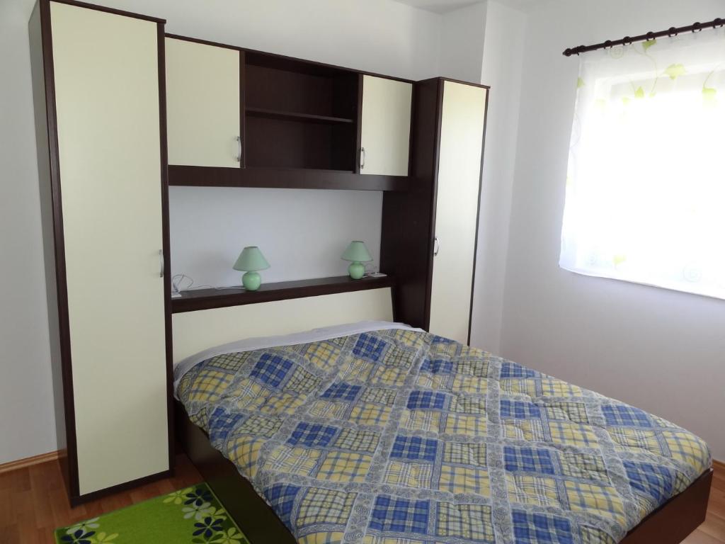 Posteľ alebo postele v izbe v ubytovaní Apartments Mišon