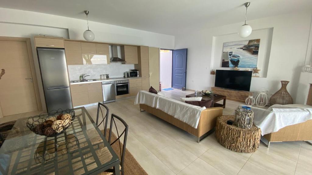 A kitchen or kitchenette at NV seafront Villa Aegina