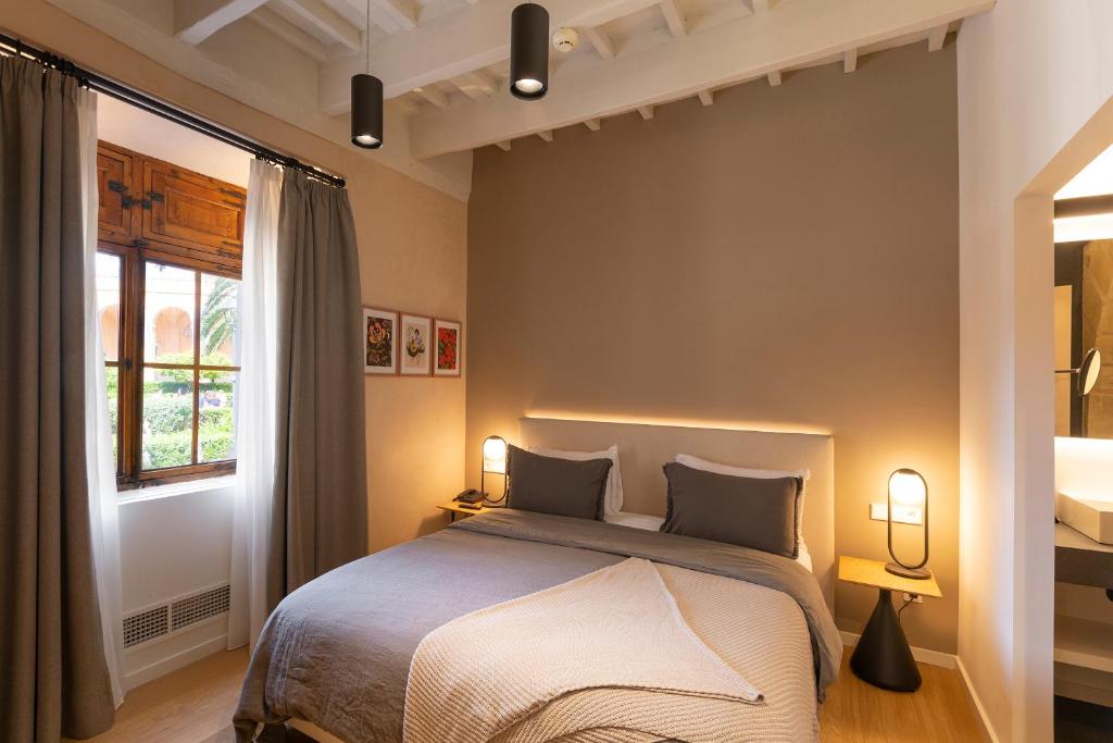 Postel nebo postele na pokoji v ubytování Hotel Can Cirera