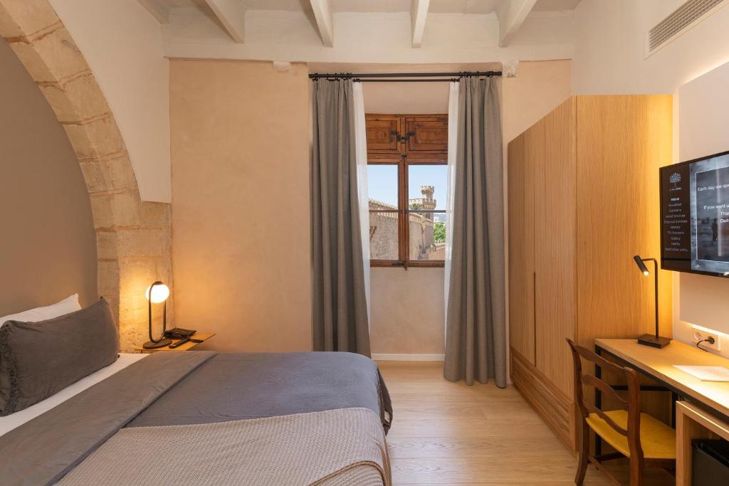 Postel nebo postele na pokoji v ubytování Hotel Can Cirera