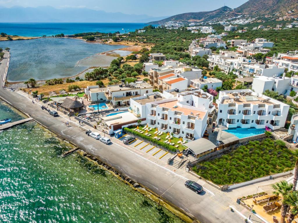 an aerial view of a town next to the water at Elounda Alikes Suites & Studios in Elounda