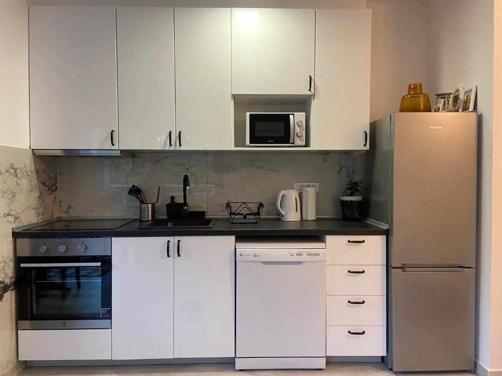 Kuchyň nebo kuchyňský kout v ubytování Hygge Apartments