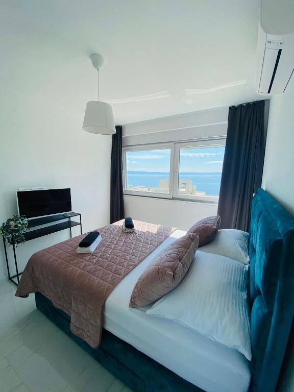 Posteľ alebo postele v izbe v ubytovaní Sunshine House Makarska with Free Beach Parking