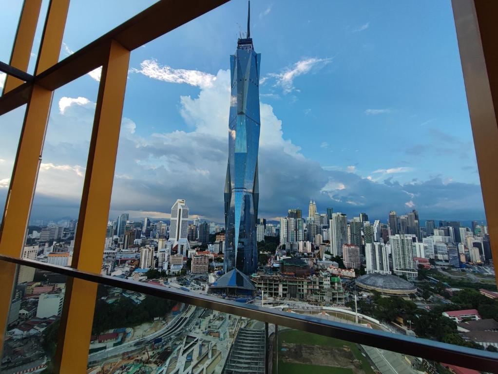 a view of the burj khalifa from the top of the building at Opus Residences Warisan Merdeka by C&C Fortune in Kuala Lumpur