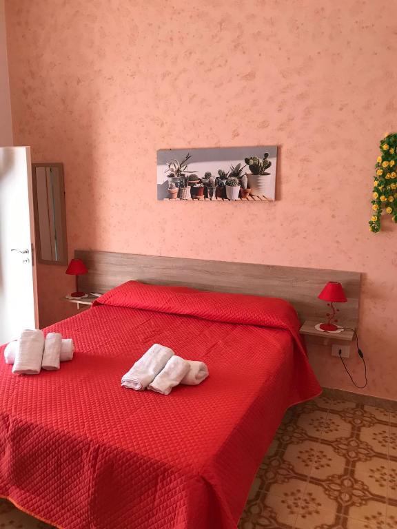 Postel nebo postele na pokoji v ubytování La Scalinata 2