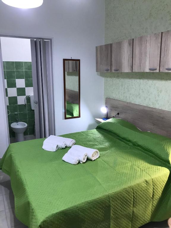 Postel nebo postele na pokoji v ubytování La Scalinata 2