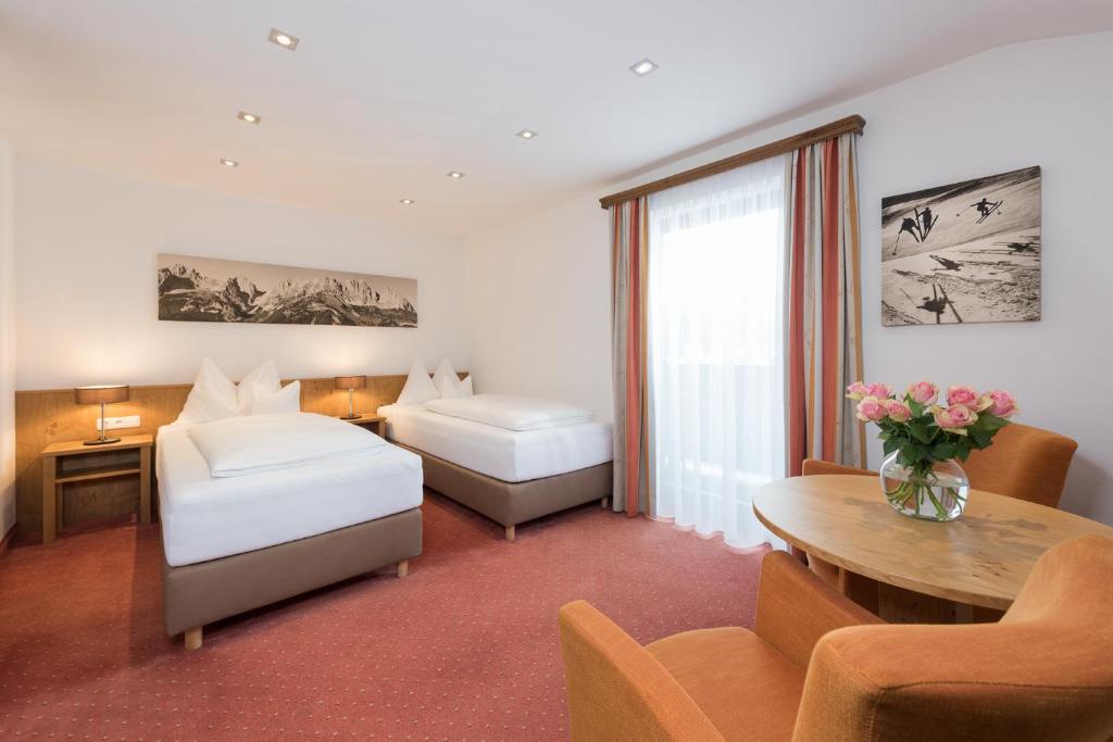 A bed or beds in a room at Hotel Resch