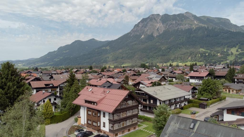 a town with a mountain in the background at Goldbrunn in Oberstdorf
