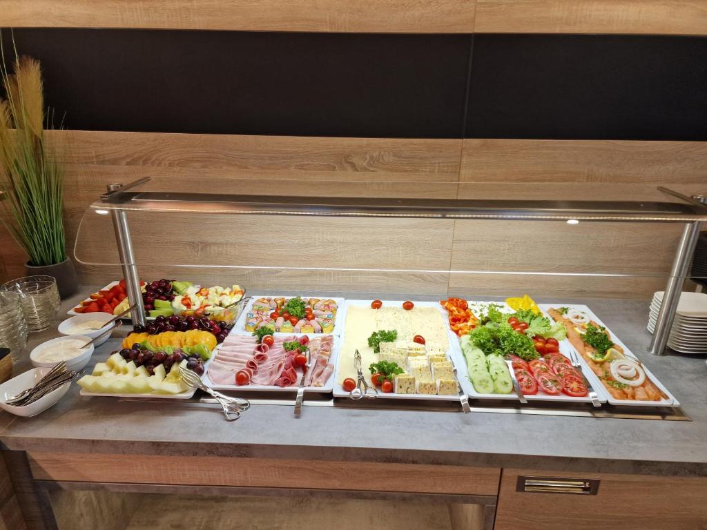 a buffet with many different types of food on a table at Hotel Ocean in Norden