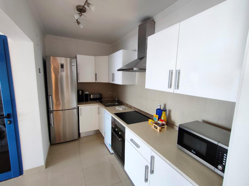 Kuchyň nebo kuchyňský kout v ubytování Villa Aroa by Villalia