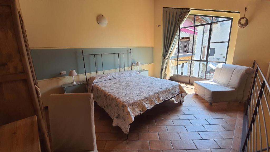 Postel nebo postele na pokoji v ubytování Le Quattro Stagioni B&B and Apartament