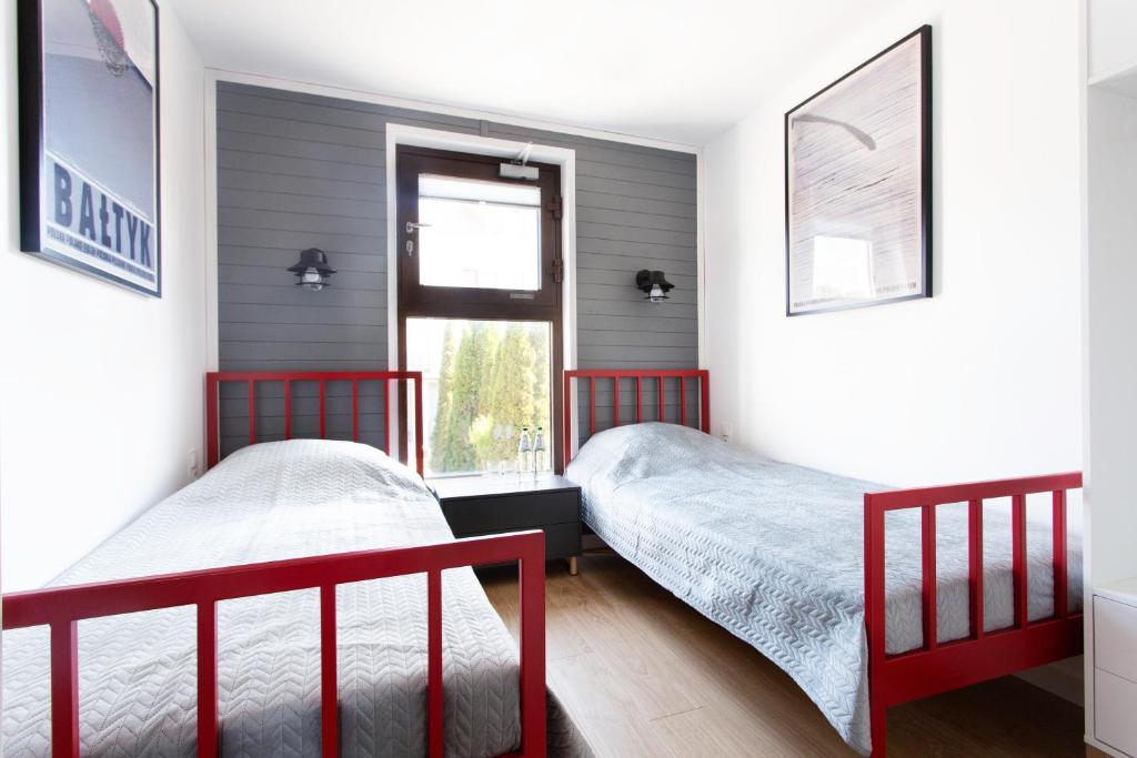 Posteľ alebo postele v izbe v ubytovaní Szumiwoda Apartamenty Kuźnica