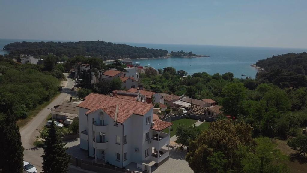 an aerial view of a house and the water at Villa Mara in Pula