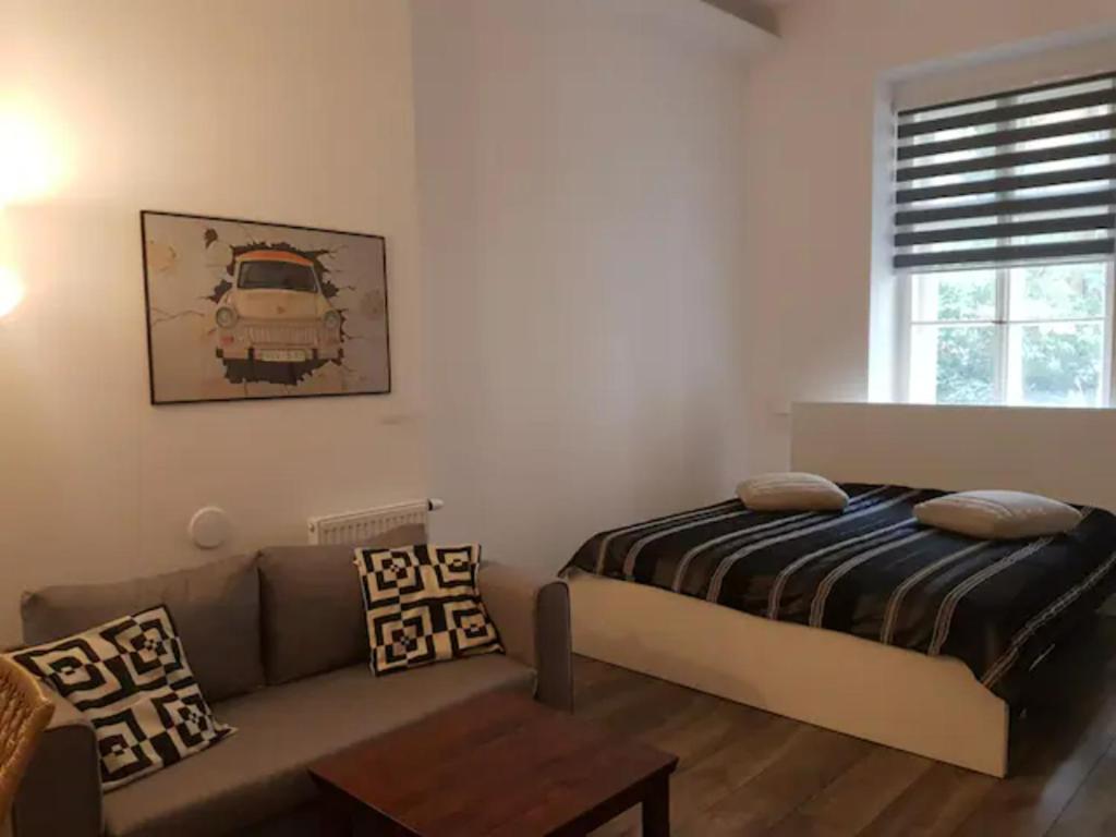 Postel nebo postele na pokoji v ubytování Maximilian central apartment