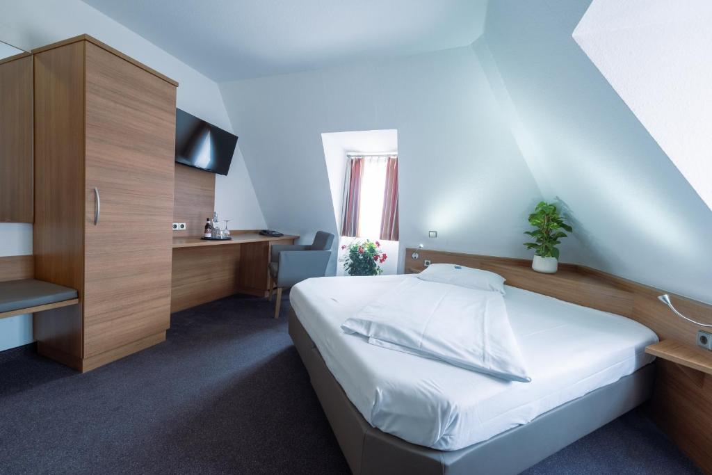 Postel nebo postele na pokoji v ubytování Hotel Bär