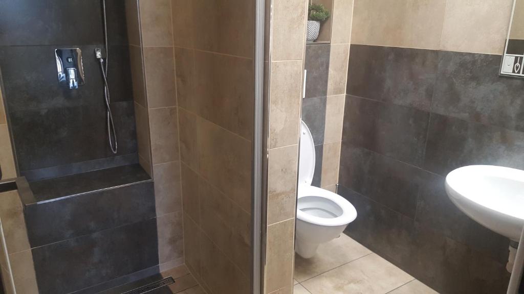 Koupelna v ubytování Hotel Camelot