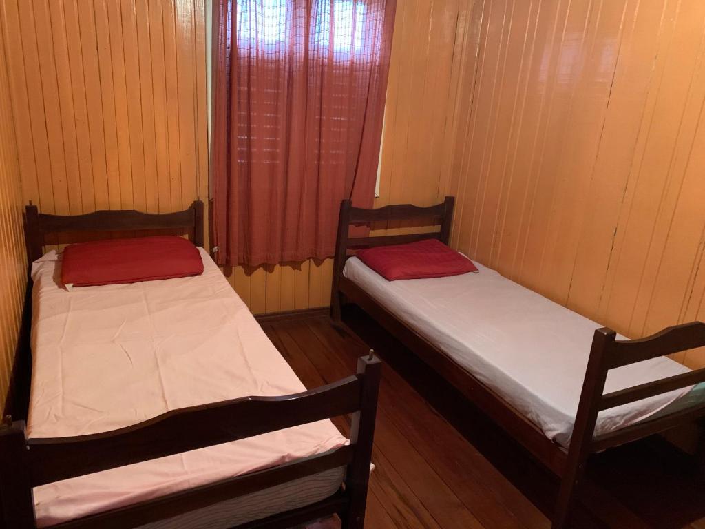 Postel nebo postele na pokoji v ubytování Casa de Campos do Jordão